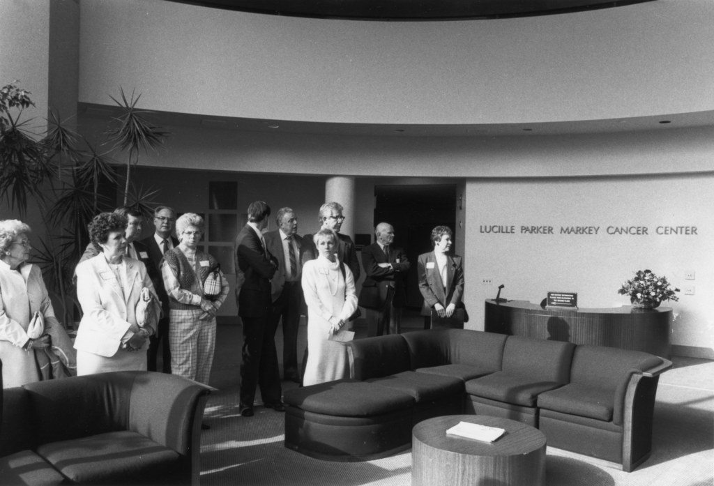 people congregating in markey cancer center lobby, old photo